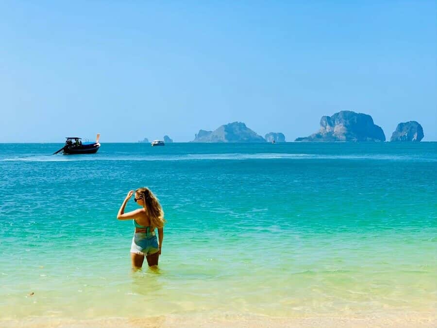 White sand beach and clear shallow water on the Phi Phi Island full day tour