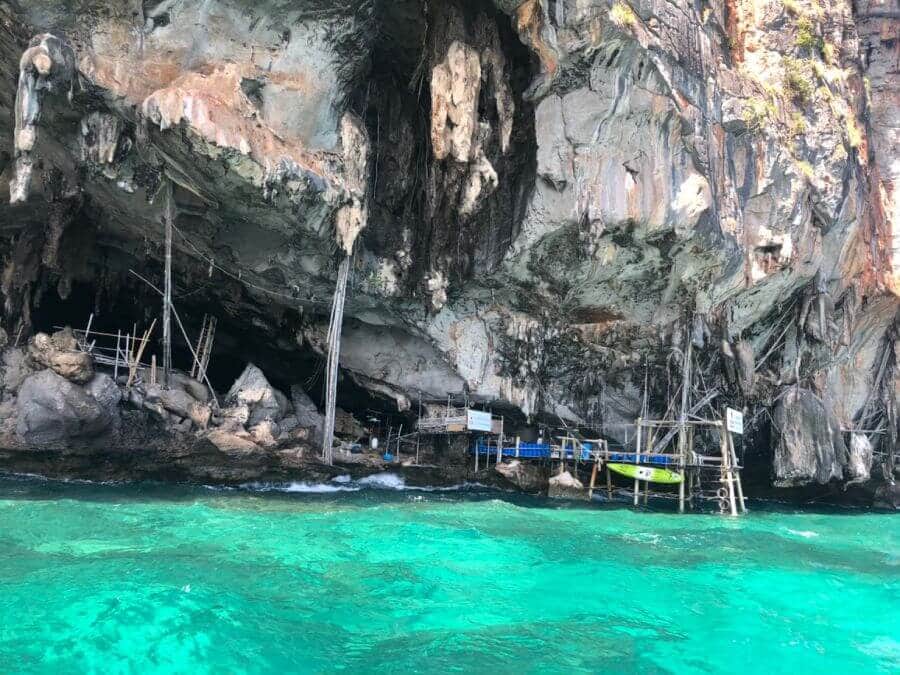 Viking Cave and its bird's nest scaffolding, seen from the boat on the Phi Phi Island tour