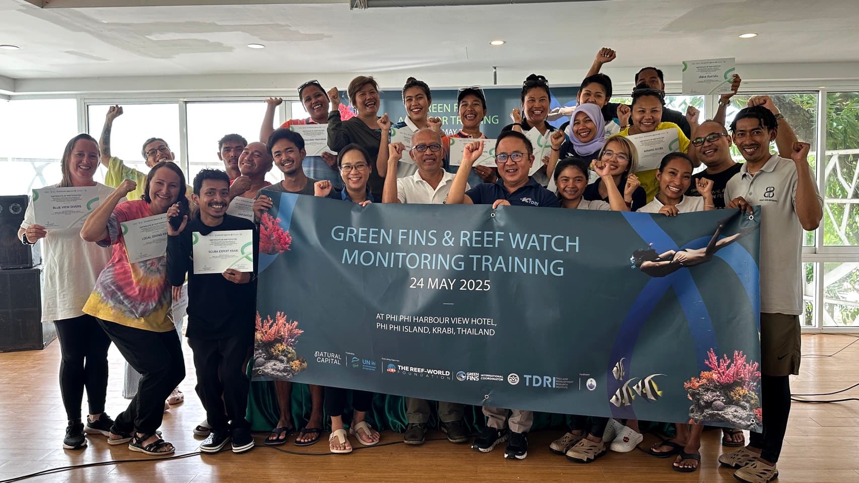 Krabi operators holding their certificates of participation at the end of the Green Fins and Reef Watch training